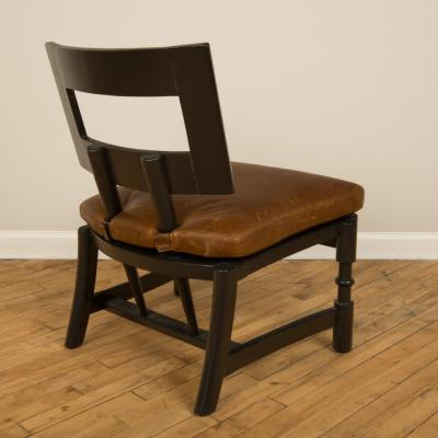 A Mid Century single armchair with leather seat