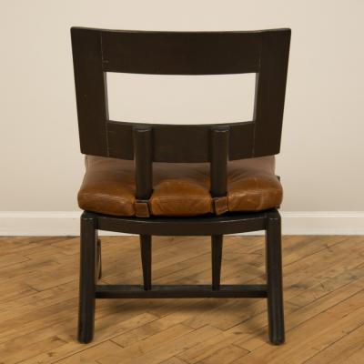A Mid Century single armchair with leather seat