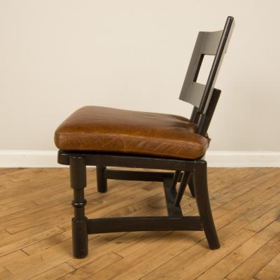 A Mid Century single armchair with leather seat