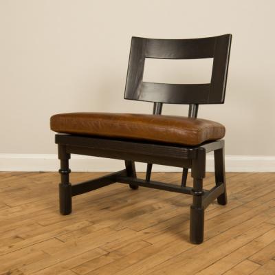 A Mid Century single armchair with leather seat