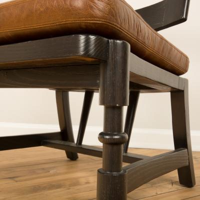 A Mid Century single armchair with leather seat