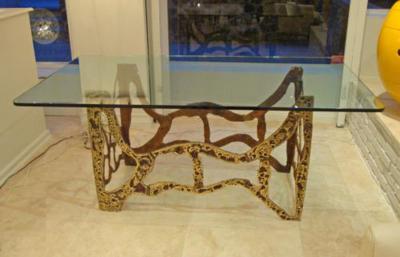 A Modernist Dining Table in Sand Cast Bronze and Glass