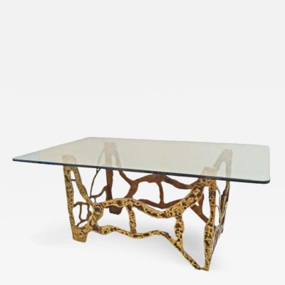 A Modernist Dining Table in Sand Cast Bronze and Glass