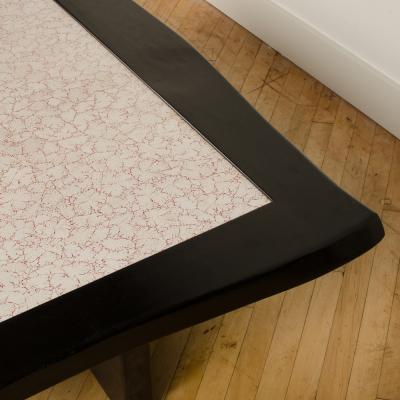 A Modernist rectangular coffee table with eggshell fragment top Contemporary