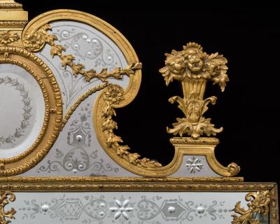 A NEAR PAIR OF VICTORIAN PERIOD ORMOLU MOUNTED ENGRAVED MIRRORS