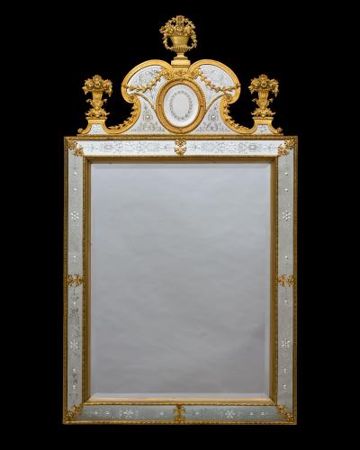 A NEAR PAIR OF VICTORIAN PERIOD ORMOLU MOUNTED ENGRAVED MIRRORS