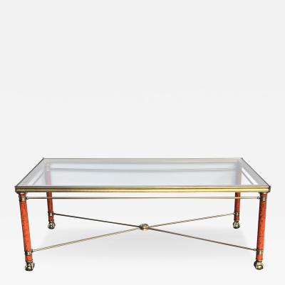 A Neoclassical Style Bronze and Brass Rectangular Table with Glass Top