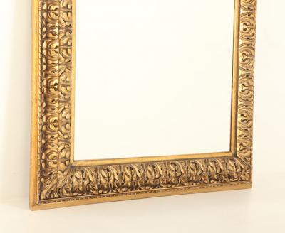 A Nineteenth Century continental relief and gilt carved mirror 