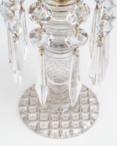 A PAIR OF ANTIQUE REGENCY CUT GLASS CANDLESTICKS