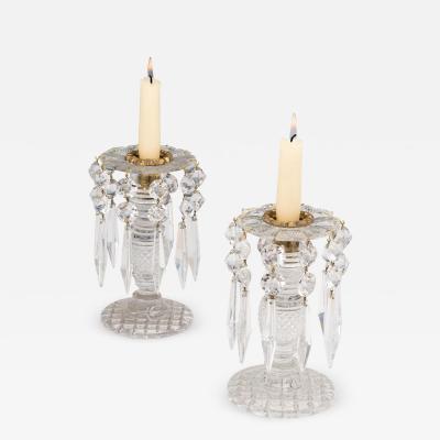 A PAIR OF ANTIQUE REGENCY CUT GLASS CANDLESTICKS