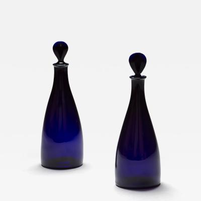 A PAIR OF BRISTOL BLUE SPIRIT DECANTERS