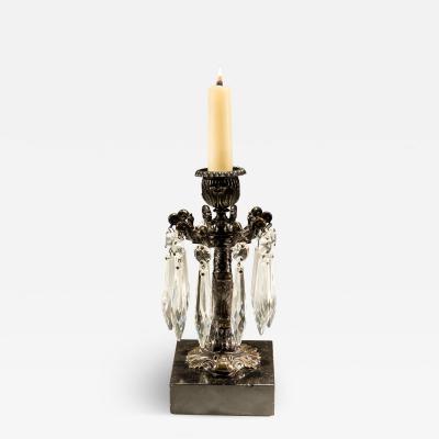 A PAIR OF BRONZED DOLPHIN CANDLESTICKS