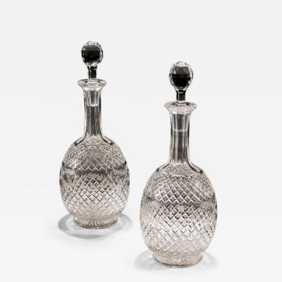 A PAIR OF CUT AND ENGRAVED VICTORIAN CRYSTAL DECANTERS