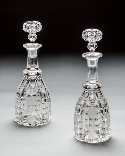 A PAIR OF CUT AND ENGRAVED VICTORIAN DECANTERS