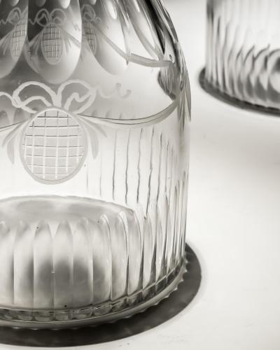 A PAIR OF DECANTERS OF NAUTICAL INTEREST WITH FIVE MATCHING GLASSES