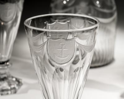 A PAIR OF DECANTERS OF NAUTICAL INTEREST WITH FIVE MATCHING GLASSES