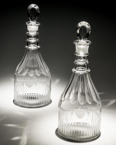 A PAIR OF DECANTERS OF NAUTICAL INTEREST WITH FIVE MATCHING GLASSES