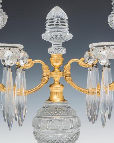 A PAIR OF DIAMOND CUT REGENCY CANDELABRA