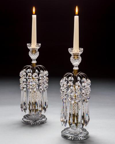 A PAIR OF DIAMOND STEP CUT REGENCY CANDLESTICKS