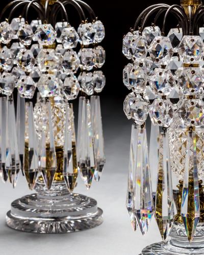 A PAIR OF DIAMOND STEP CUT REGENCY CANDLESTICKS