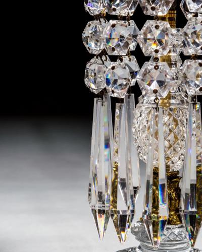 A PAIR OF DIAMOND STEP CUT REGENCY CANDLESTICKS