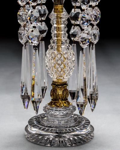 A PAIR OF DIAMOND STEP CUT REGENCY CANDLESTICKS