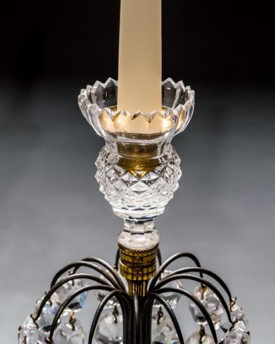 A PAIR OF DIAMOND STEP CUT REGENCY CANDLESTICKS