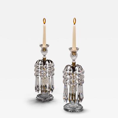 A PAIR OF DIAMOND STEP CUT REGENCY CANDLESTICKS