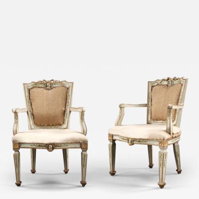 A PAIR OF EARLY NEOCLASSICAL PALE BLUE PAINTED GROUND AND GILDED ARMCHAIRS