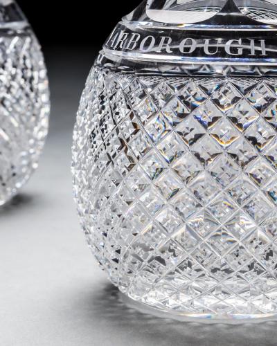 A PAIR OF ELABORATELY CUT DECANTERS OF MASONIC INTEREST