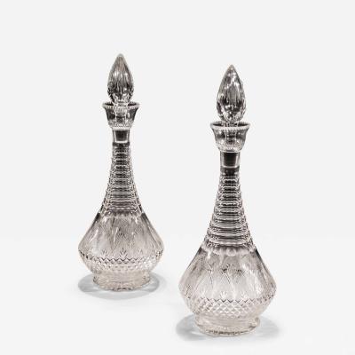 A PAIR OF ELABORATELY CUT VICTORIAN DECANTERS