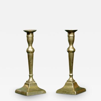 A PAIR OF ENGLISH BRASS CANDLESTICKS