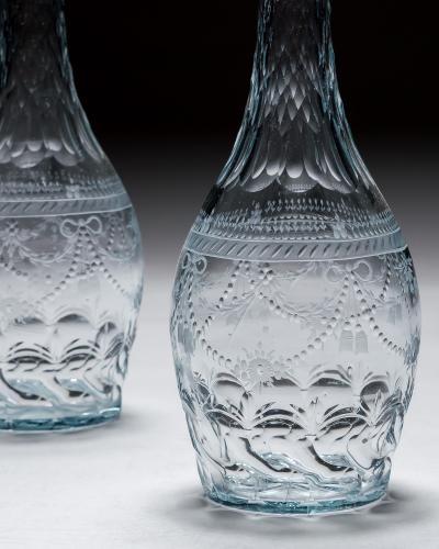 A PAIR OF ENGRAVED CONTINENTAL DECANTERS
