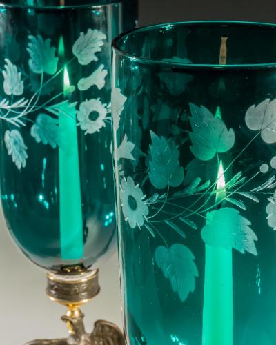 A PAIR OF ENGRAVED GREEN STORM SHADES ON EAGLE BASES