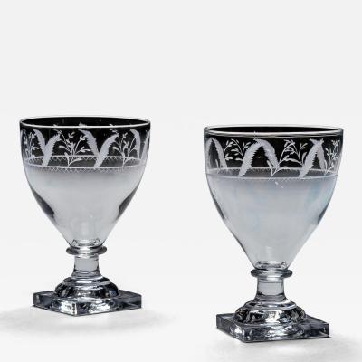 A PAIR OF ENGRAVED SQUARE BASE RUMMERS