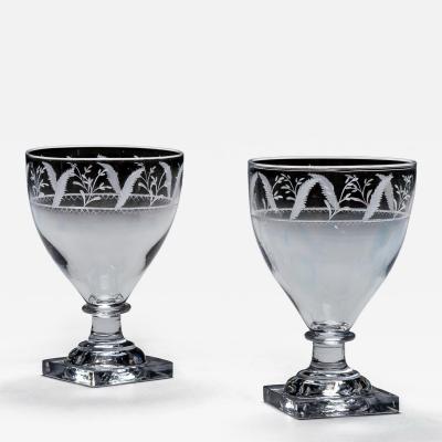 A PAIR OF ENGRAVED SQUARE BASE RUMMERS