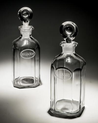 A PAIR OF ENGRAVED SQUARE SPIRIT BOTTLES