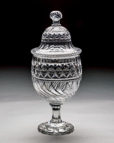 A PAIR OF GEORGE III CUT GLASS URNS COVERS OF EXCEPTIONAL SIZE QUALITY