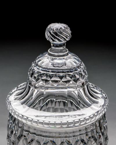 A PAIR OF GEORGE III CUT GLASS URNS COVERS OF EXCEPTIONAL SIZE QUALITY