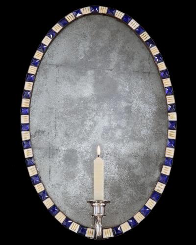 A PAIR OF GEORGE III IRISH OVAL MIRROR GIRANDOLES