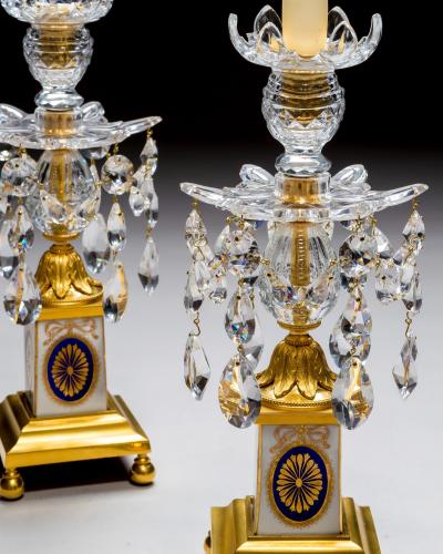 A PAIR OF GEORGE III ORMOLU MOUNTED PORCELAIN CUT GLASS CANDLESTICKS