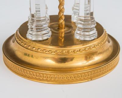 A PAIR OF GEORGE III TEMPLE CANDLESTICKS