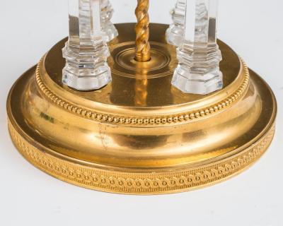 A PAIR OF GEORGE III TEMPLE CANDLESTICKS