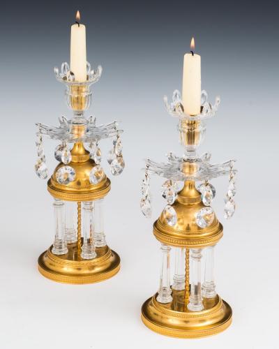 A PAIR OF GEORGE III TEMPLE CANDLESTICKS