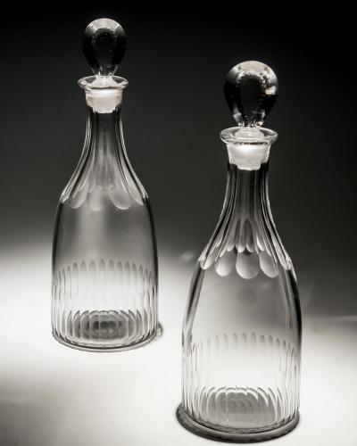 A PAIR OF GEORGIAN SLICE FLUTE SPIRIT DECANTERS