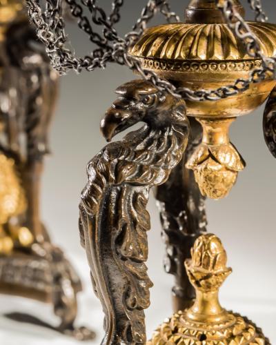 A PAIR OF GILT BRONZE GRIFFIN STORM LIGHTS