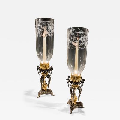 A PAIR OF GILT BRONZE GRIFFIN STORM LIGHTS