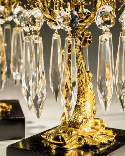 A PAIR OF GILT LACQUER DOLPHIN CANDLESTICKS