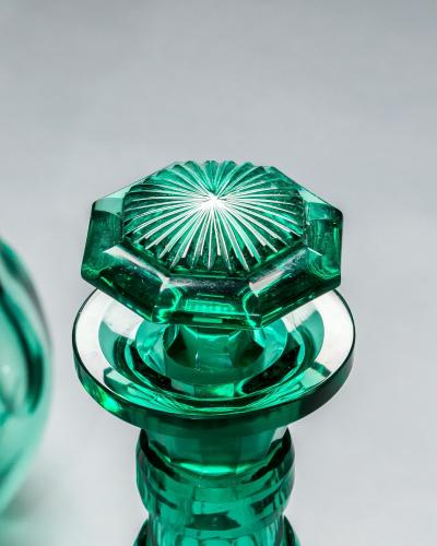 A PAIR OF GREEN SHAFT GLOBE DECANTERS