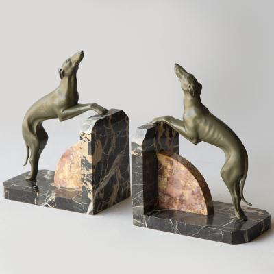 A PAIR OF LIMOUSIN PAINTED SPELTER SIGHTHOUND BOOKENDS